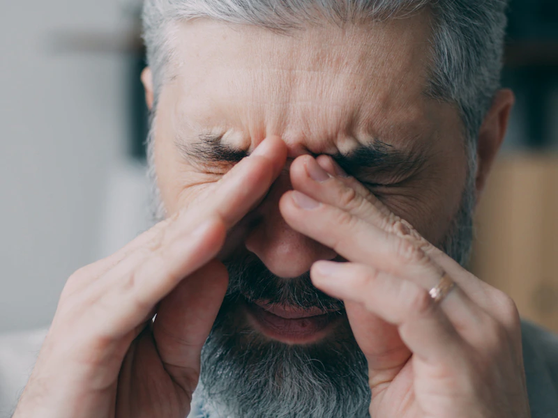 Elderly man overwhelmed by brain fog